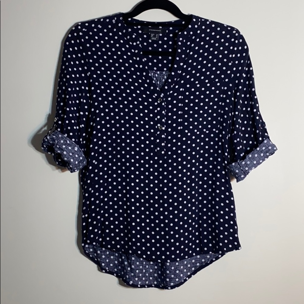 Navy blue and white polka dot blouse